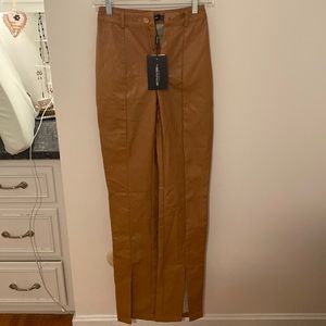NWT. PrettyLittleThing. Size 0. Tan Faux Leather. Split Hem. Straight leg.